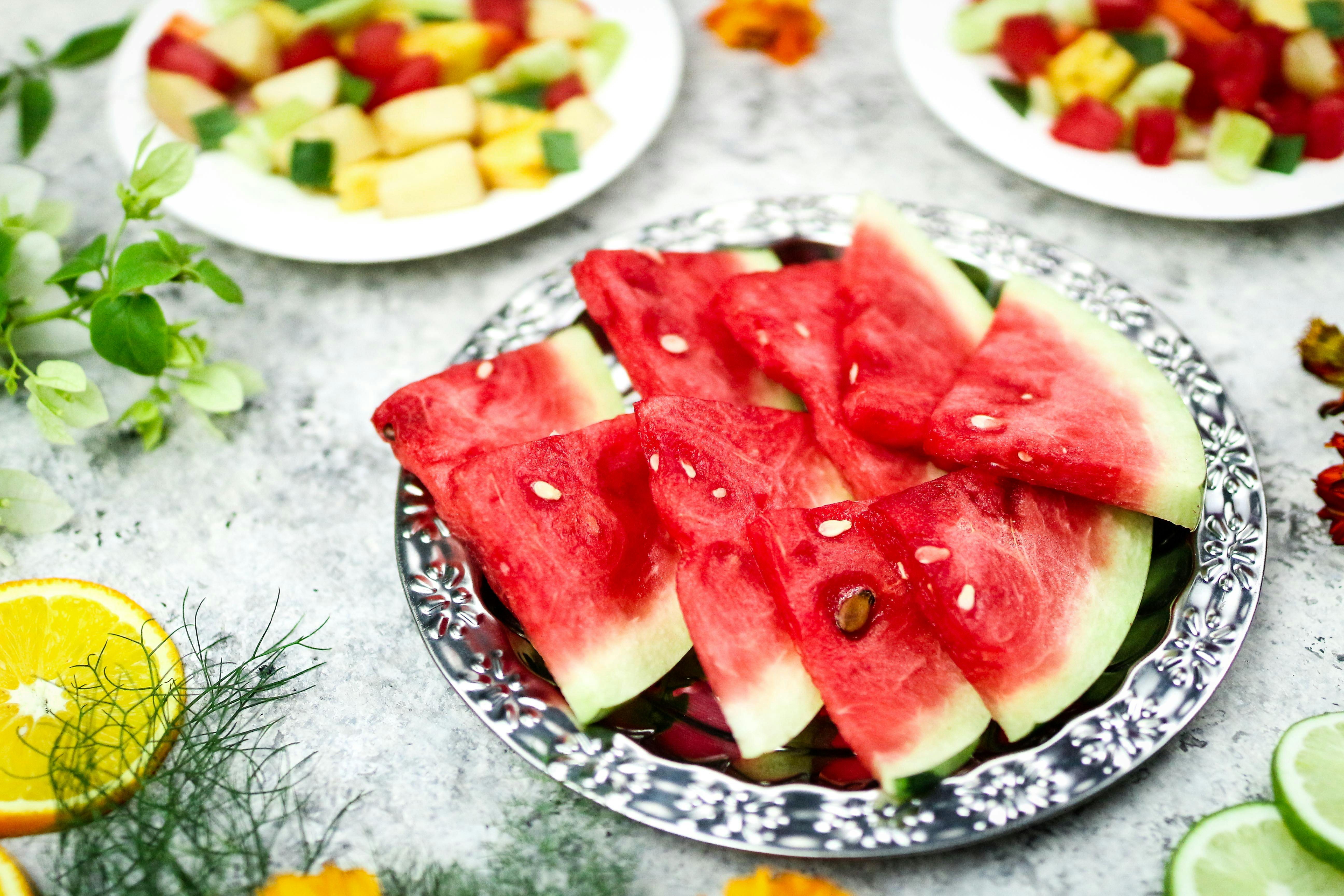 Assorted hydrating fruits including watermelon, citrus fruits, and berries that support hydration and prevent dehydration