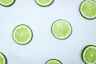Sliced Lemon on White Surface