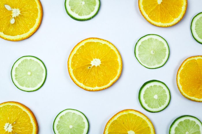 Citrus slices arranged on a bright surface. Photo by Tamanna Rumee on Pexels