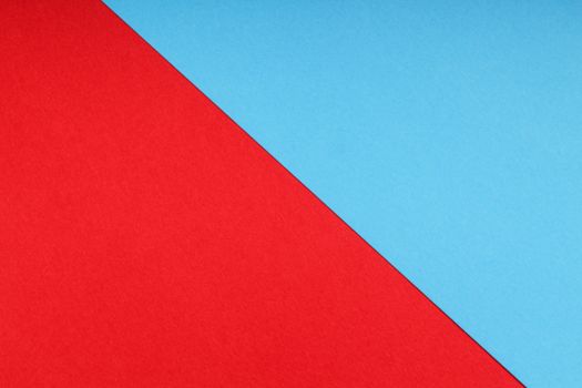 Abstract minimalist image featuring a diagonal red and blue color split, perfect for modern design projects.