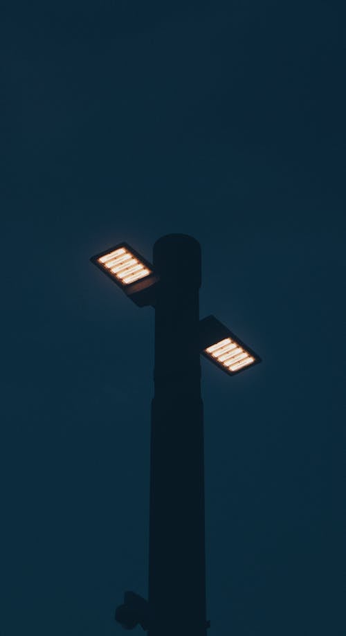 Silhouette of Lamp Post under Dark Sky