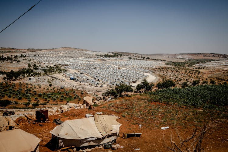 Tents In Hilly Landscape