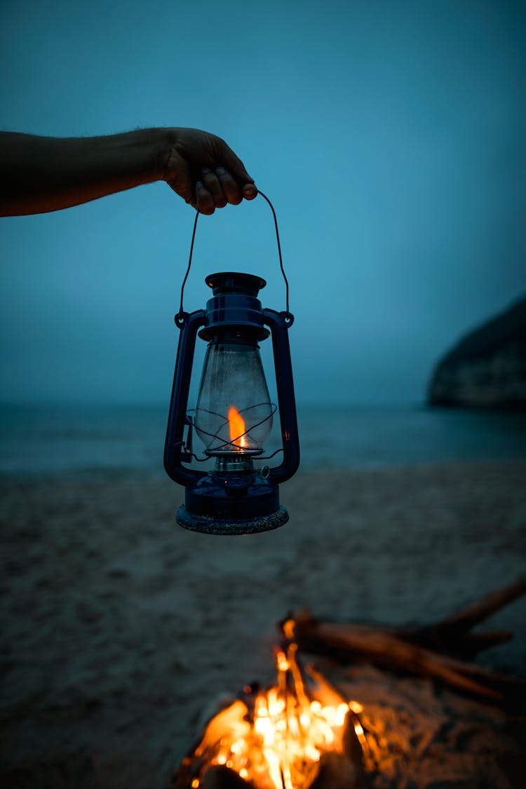 Person Holding Black Lantern Lamp