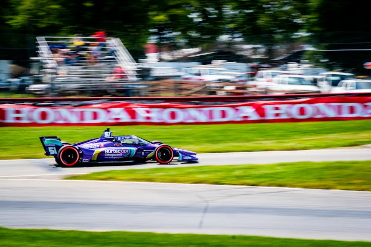 Indy Car Driving At The Race Track