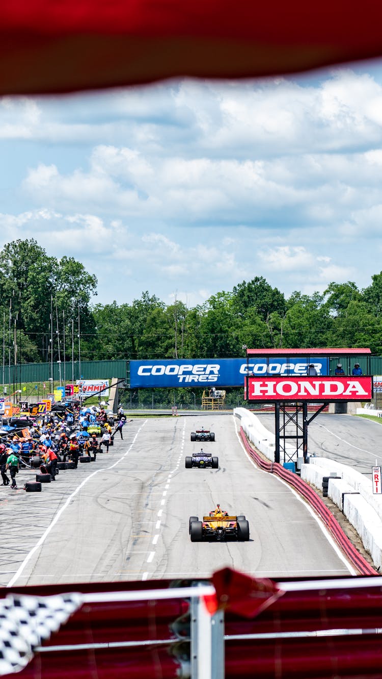 Moving Cars At A Race Track