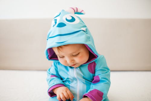 Cute Little Baby in a Blue Costume 