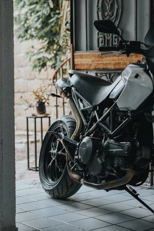 A Motorcycle Parked on the Tiled Floor