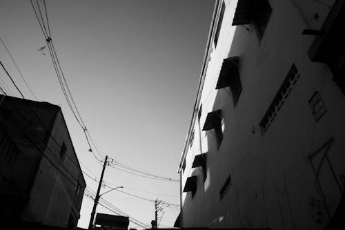 Grayscale Photo of Concrete Buildings