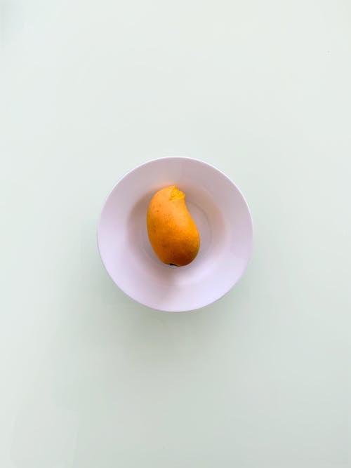 Základová fotografie zdarma na téma mango, tropické ovoce, vertikální záběr