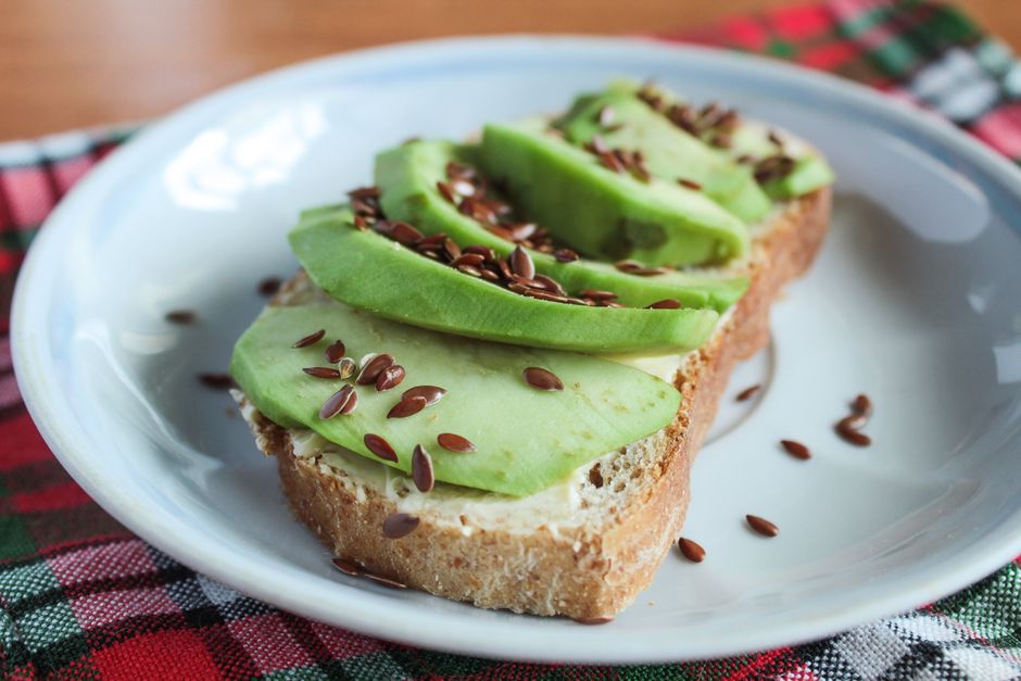 avocado and hemp seeds on whole grain toast providing healthy fats and protein - vegan lunch tips avocado and hemp seeds on whole grain toast providing healthy fats and protein - vegan lunch tips