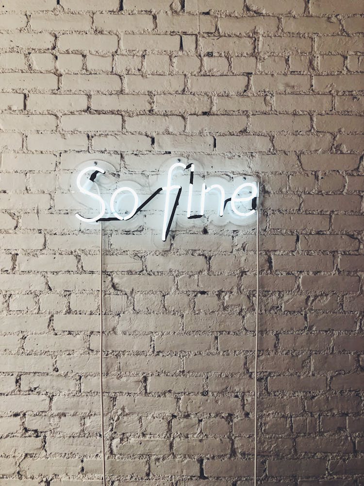 So Fine Neon Sign On White Brick Wall