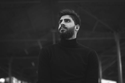 Free Grayscale Photo of a Handsome Bearded Man in a Turtle Neck Stock Photo