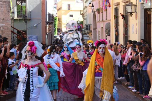 Free Colorful parade with Catrina costumes celebrating Día de los Muertos in León, Mexico. Stock Photo
