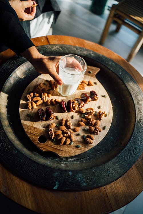 Woman Holding a Glass of Milk