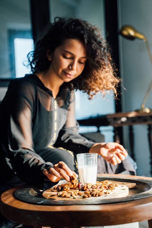 Brunette Woman Eating Sweets