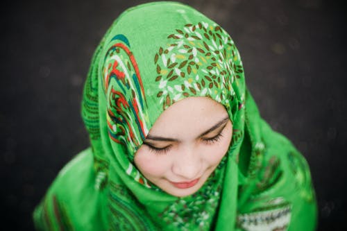A Young Woman Wearing Green Headscarf