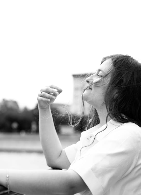 Grayscale Photo of Woman in White Shirt