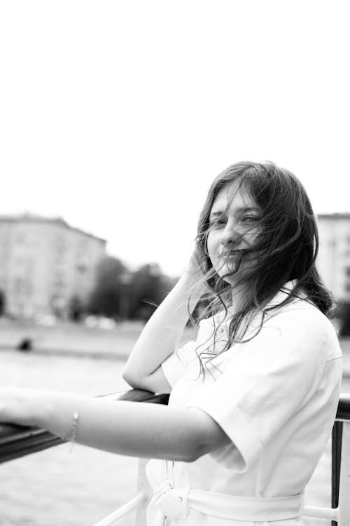 Grayscale Photo of Woman in White Shirt