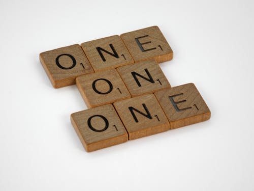 Free Wooden Letter Tiles on White Surface Stock Photo