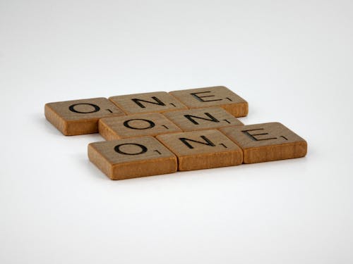 Wooden Letter Tiles in Close Up Photography