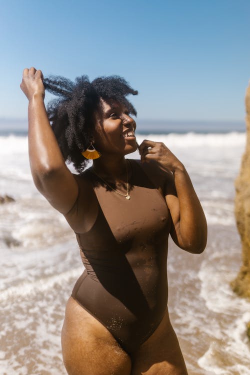 Smiling Woman in Brown Bathing Suit