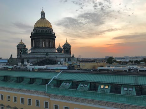 Aerial view of St. Isaac's Cathedral in Saint Petersburg during sunset, showcasing architectural beauty.