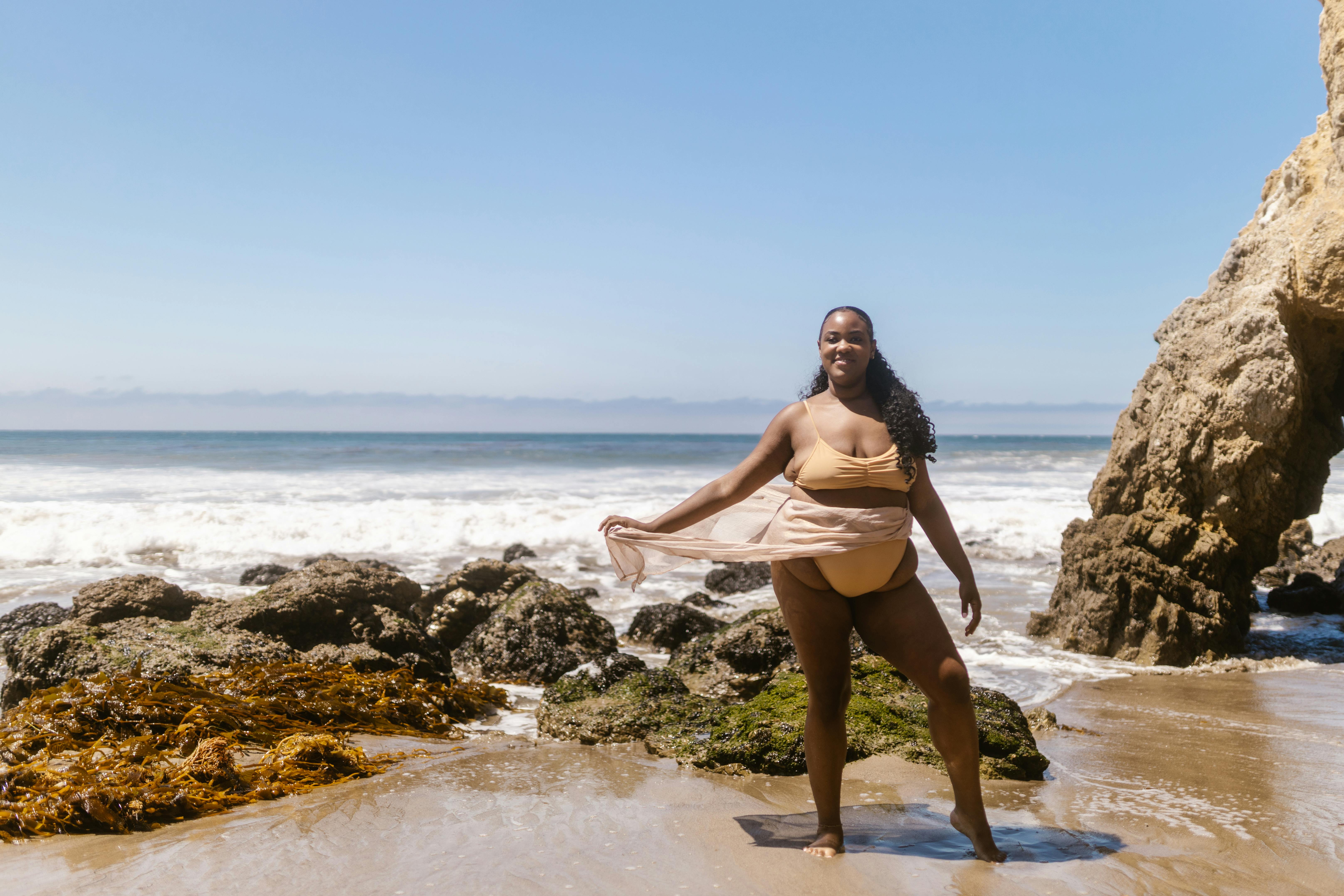 Happy, confident person post-non-invasive body contouring treatment - Non-invasive body contouring