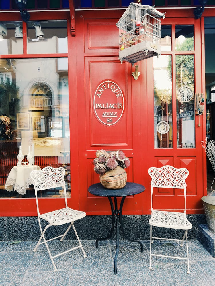 Bird Cage Hanging Outside An Antique Shop