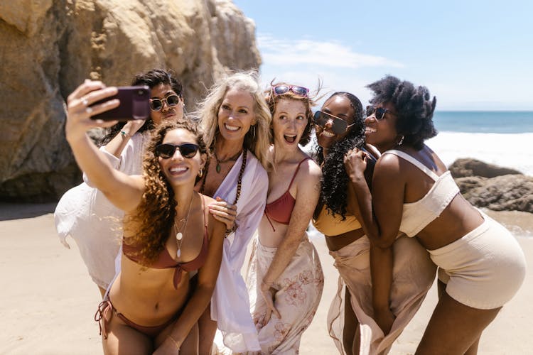 Group Of Friends Taking A Selfie At The Beach