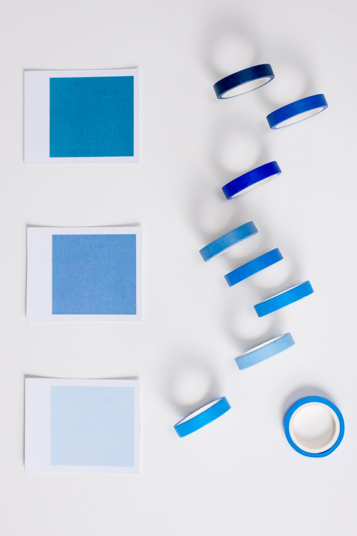 Flat lay of blue washi tape and color swatches for making duct tape bookmarks