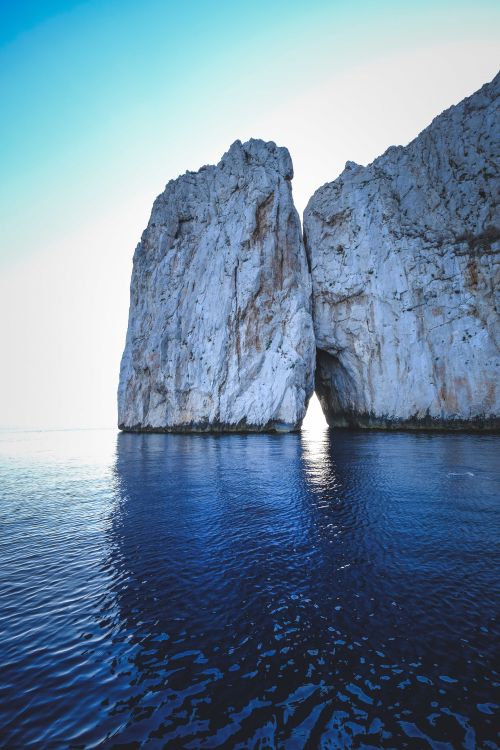 Free Stunning view of a coastal sea stack against a serene ocean backdrop, perfect for nature lovers. Stock Photo