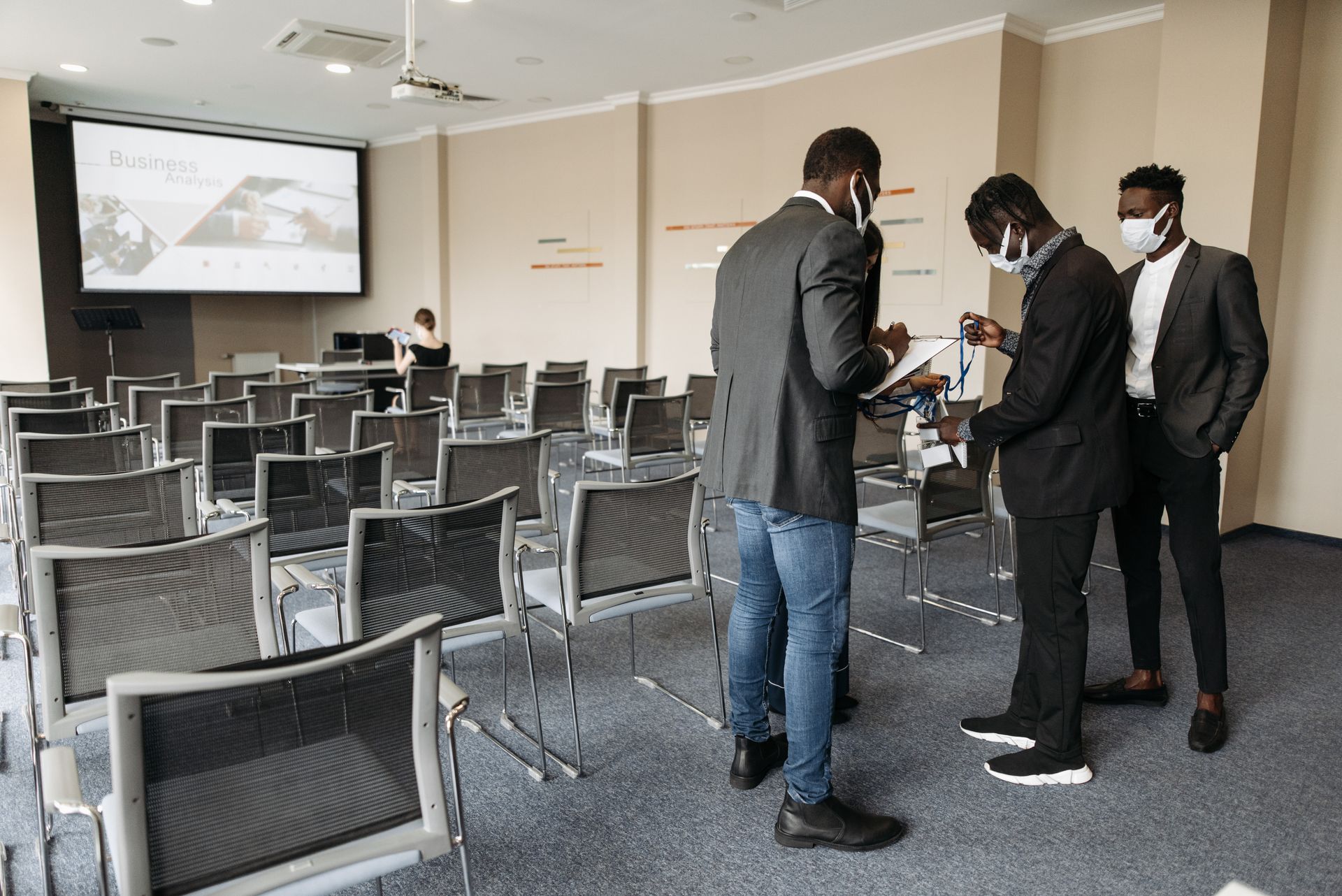People inside a Conference Room Wearing Face Masks