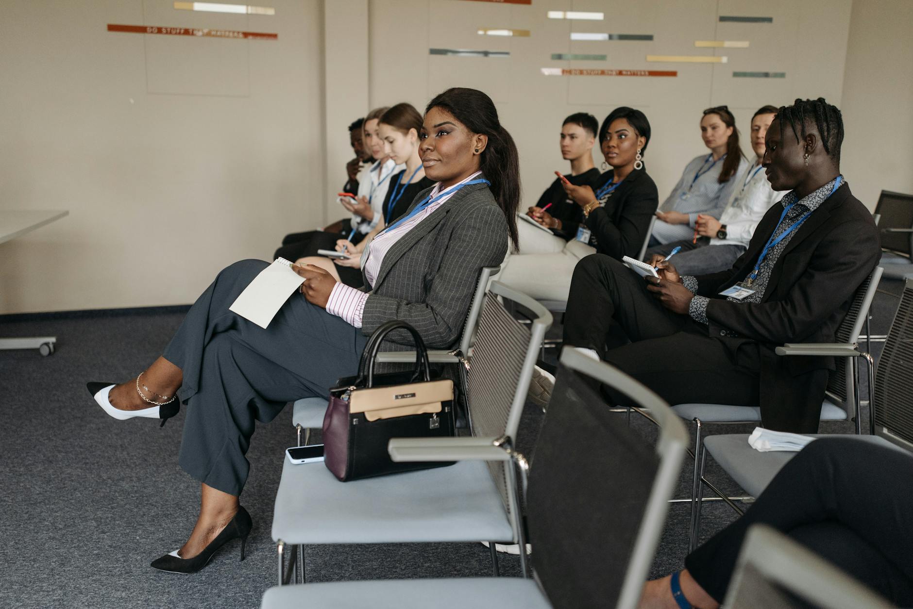 A Group of People Sitting Inside the Conference Room