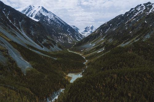 Free Scenic aerial view of Altai Mountains and winding river in Russia's Kosh-Agachsky District. Stock Photo