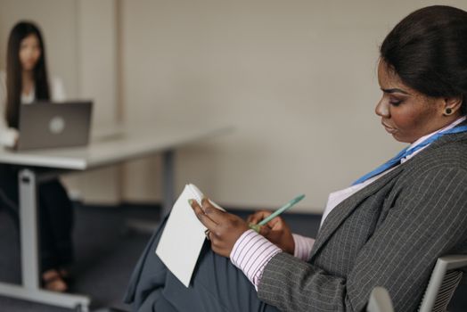 A Businesswoman Taking Notes