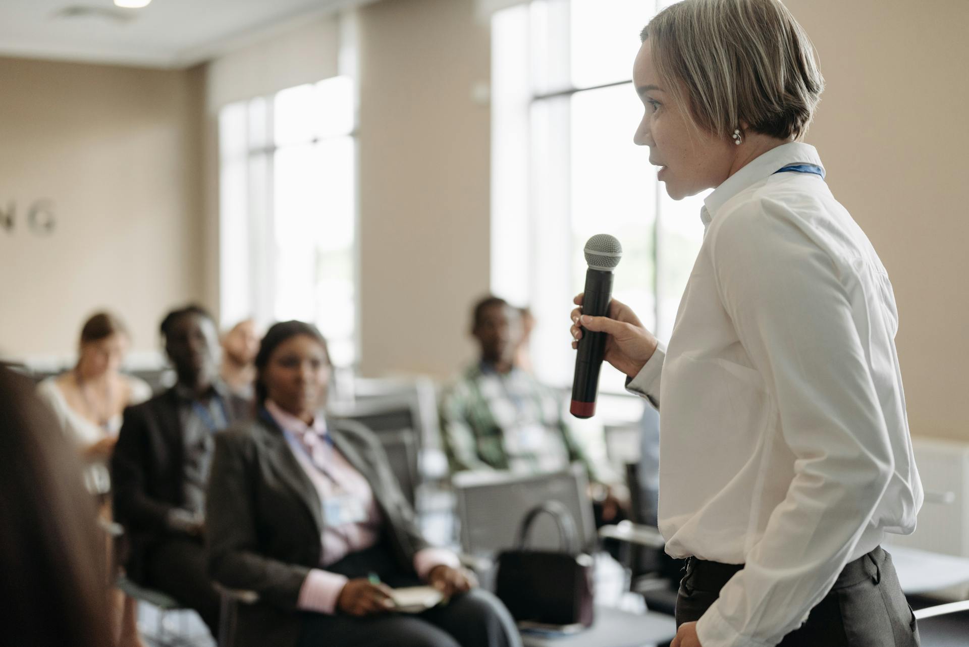 A Businesswoman Talking on a Microphone