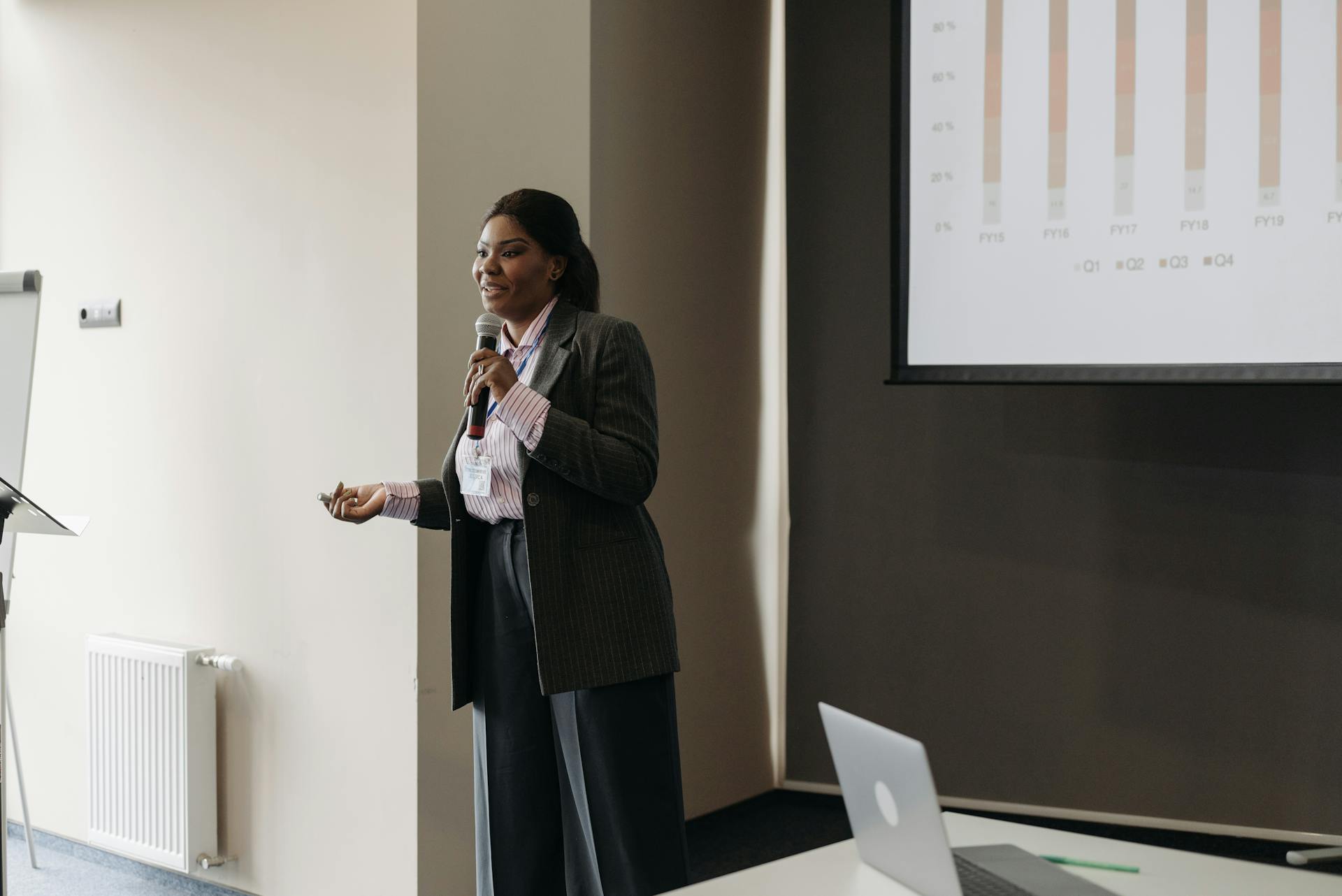 Elegant Woman Speaking at Business Conference