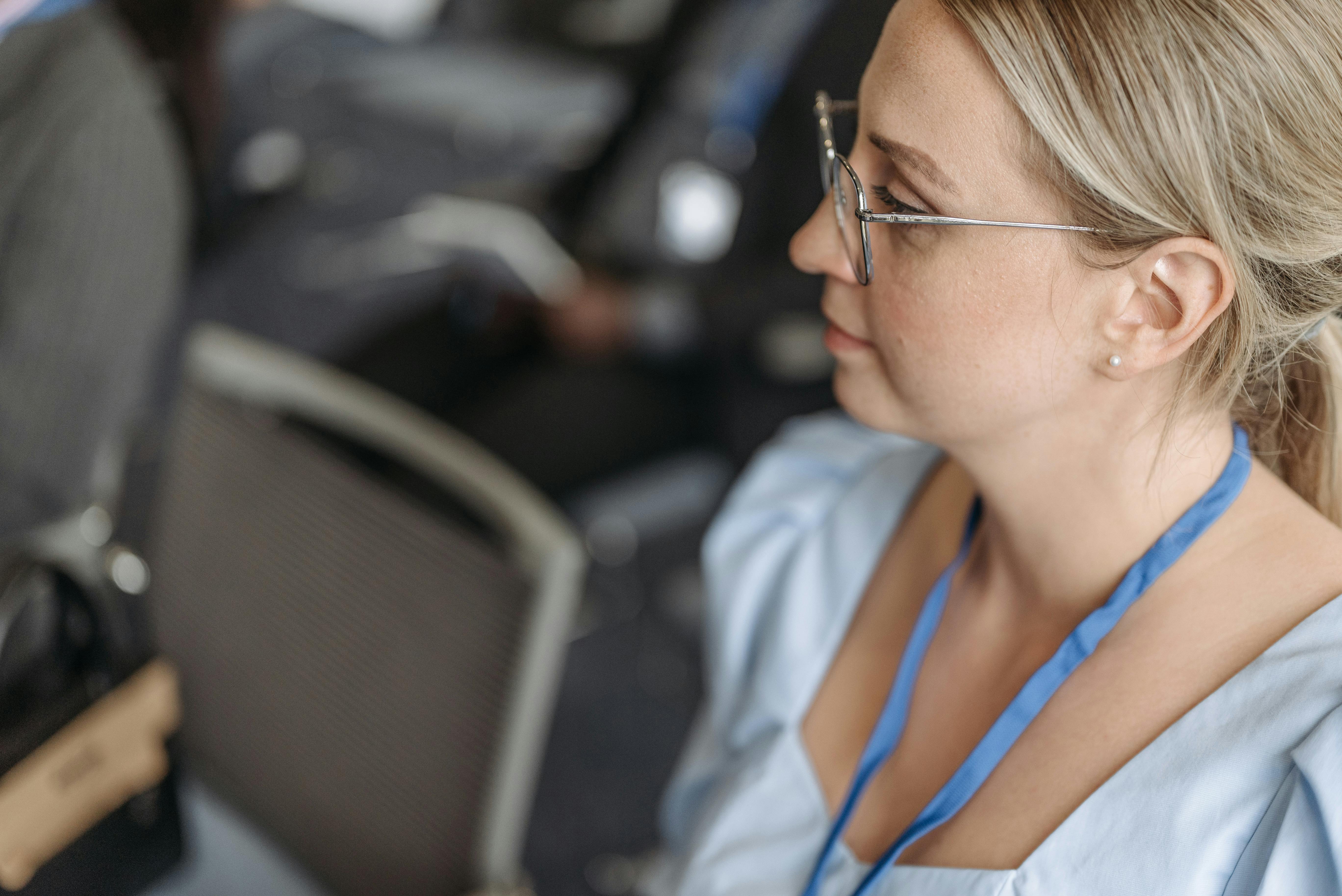Portrait of a woman concentrating at a business conference indoors.