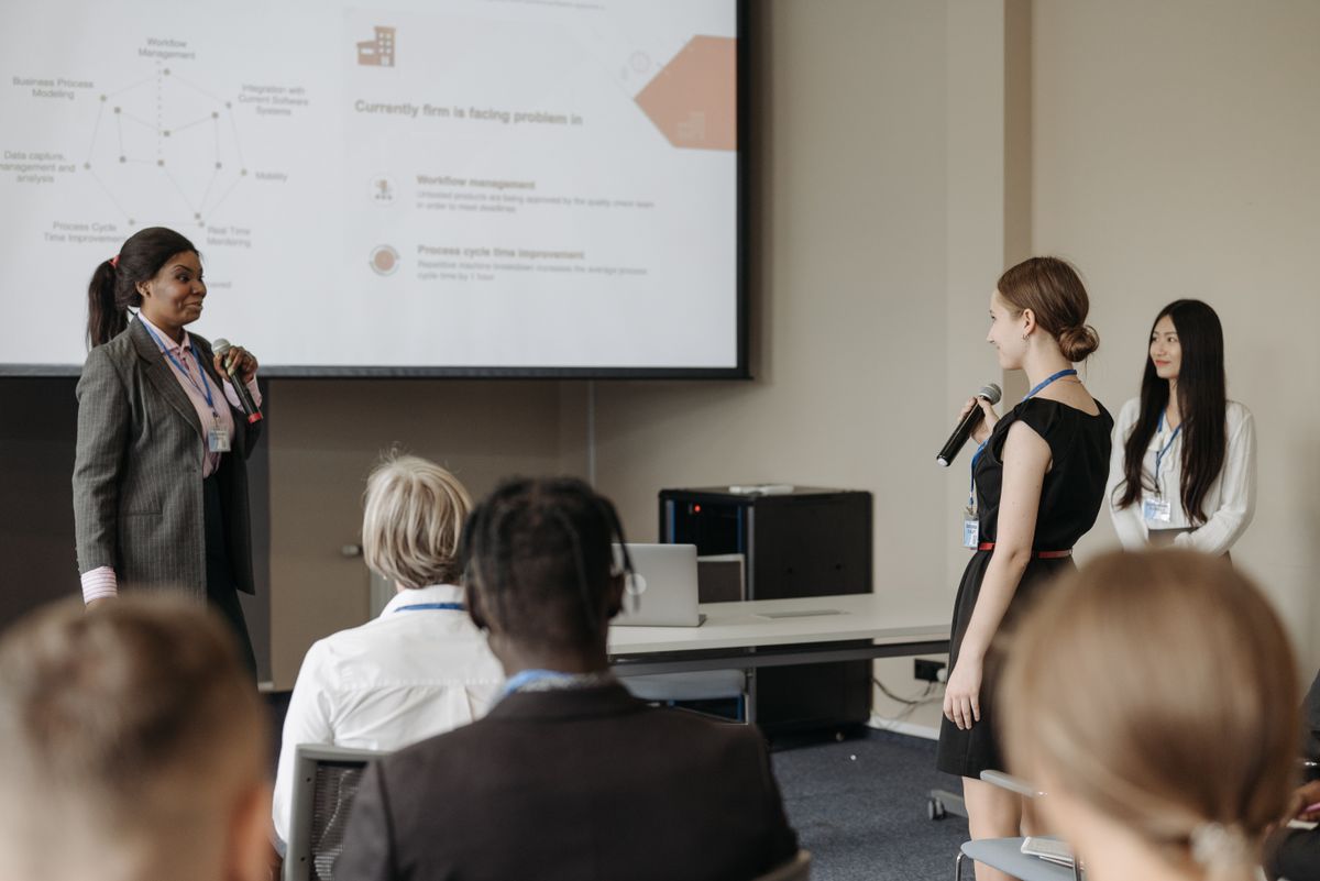 Women participating in a conference discussion