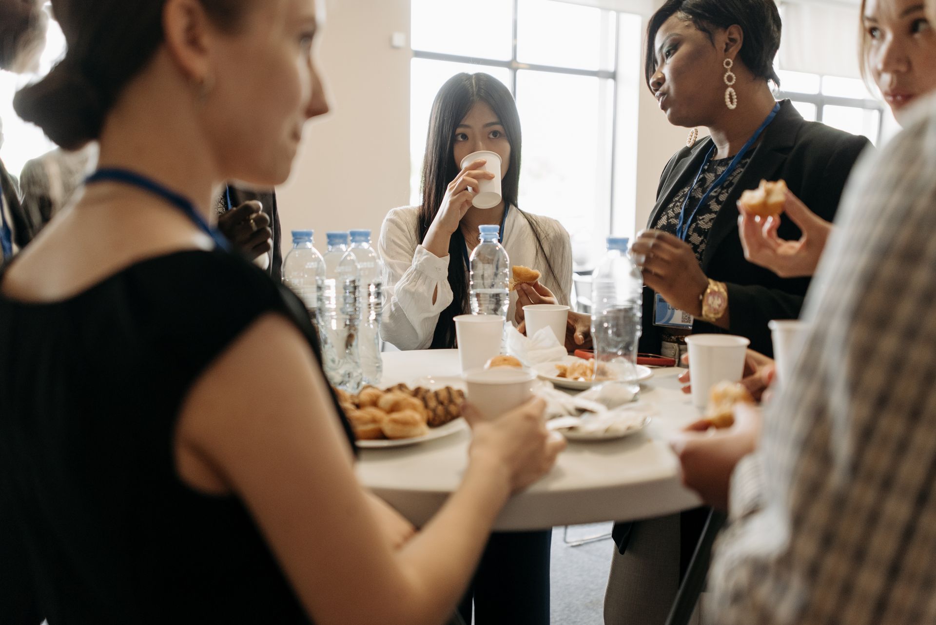 A Group of People Talking in the Office