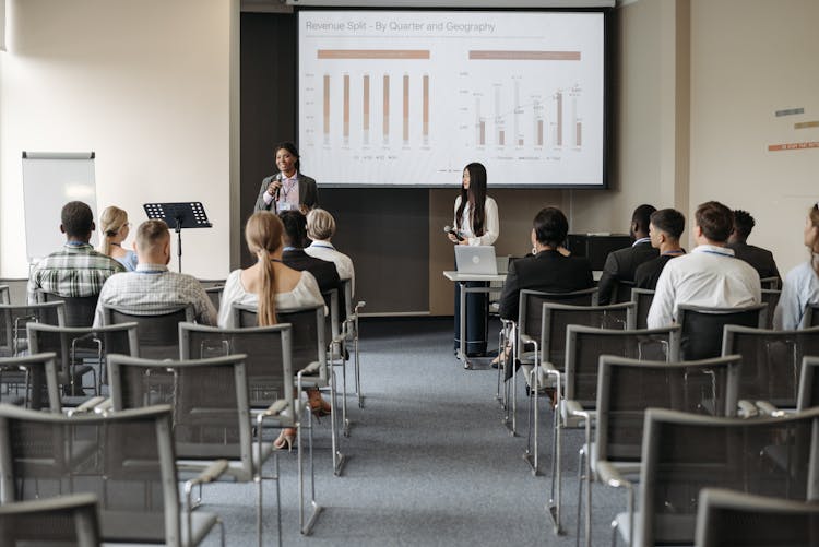 Participants Listening To A Speaker