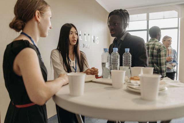 A diverse group of professionals networking at a business event with refreshments. Related image for Revenue and Distribution: How Operators Are Using Better Data.