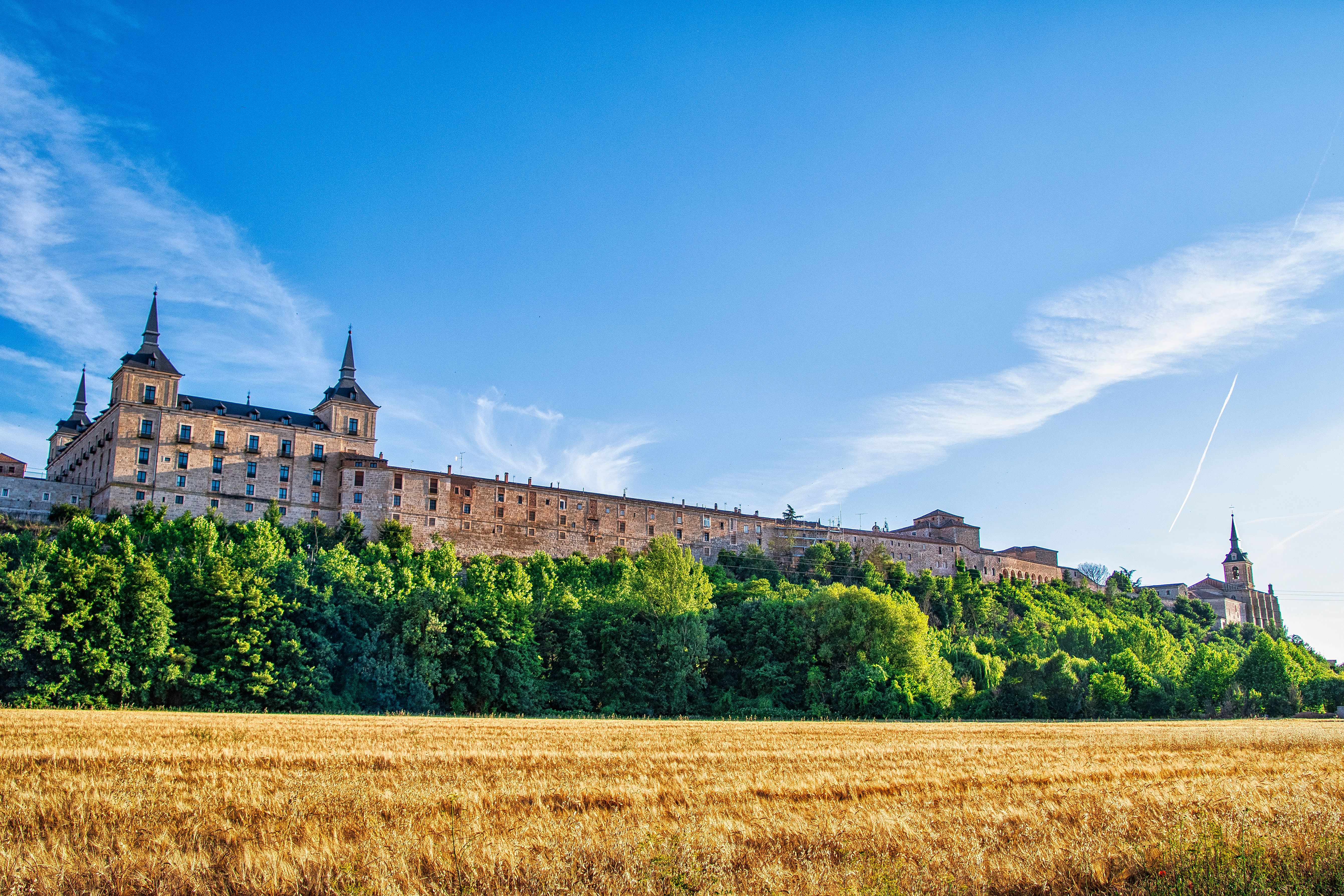 The Alcazar of Segovia seen across the valley from the fields below the village of Zamarramala