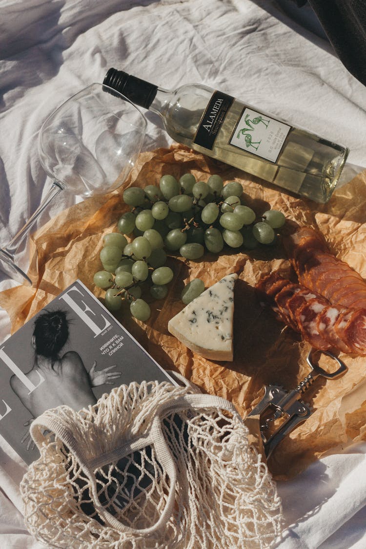 Snacks And Wine On White Fabric