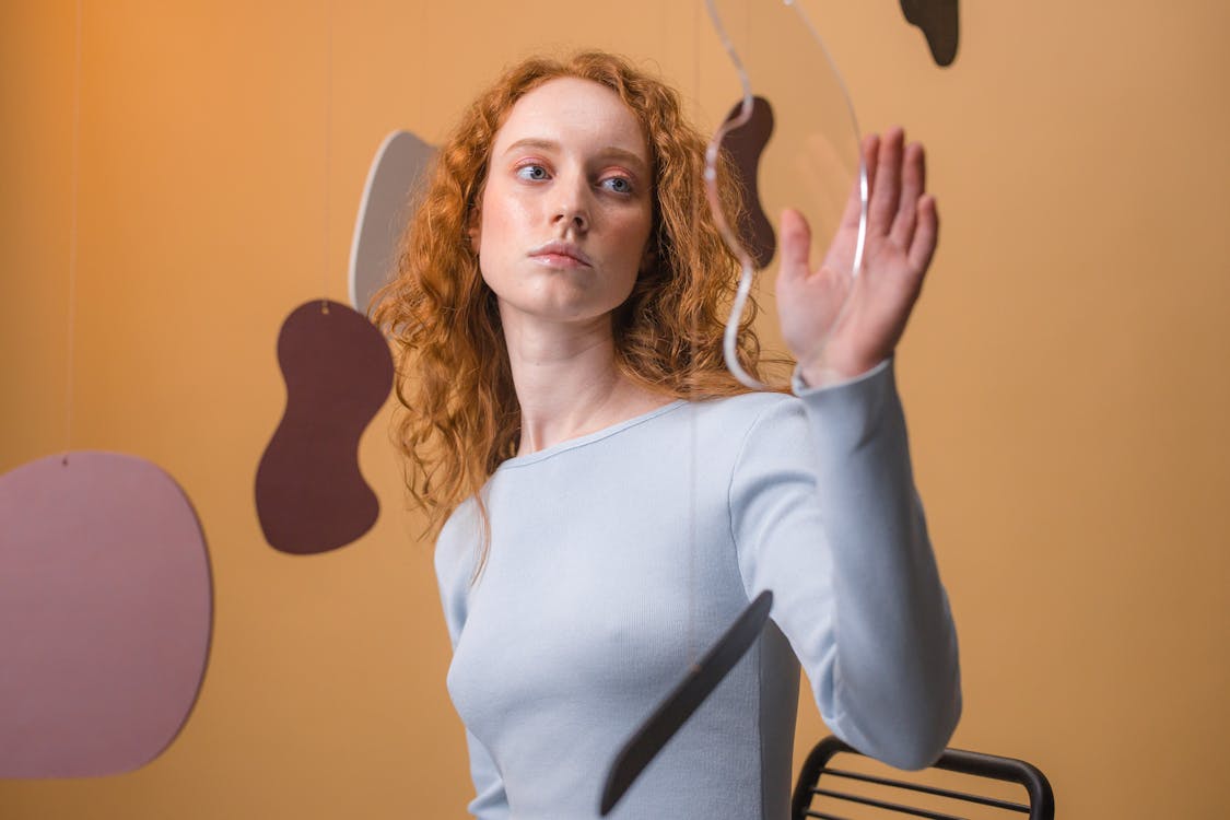 Curly Hair Woman With White Long Sleeves 