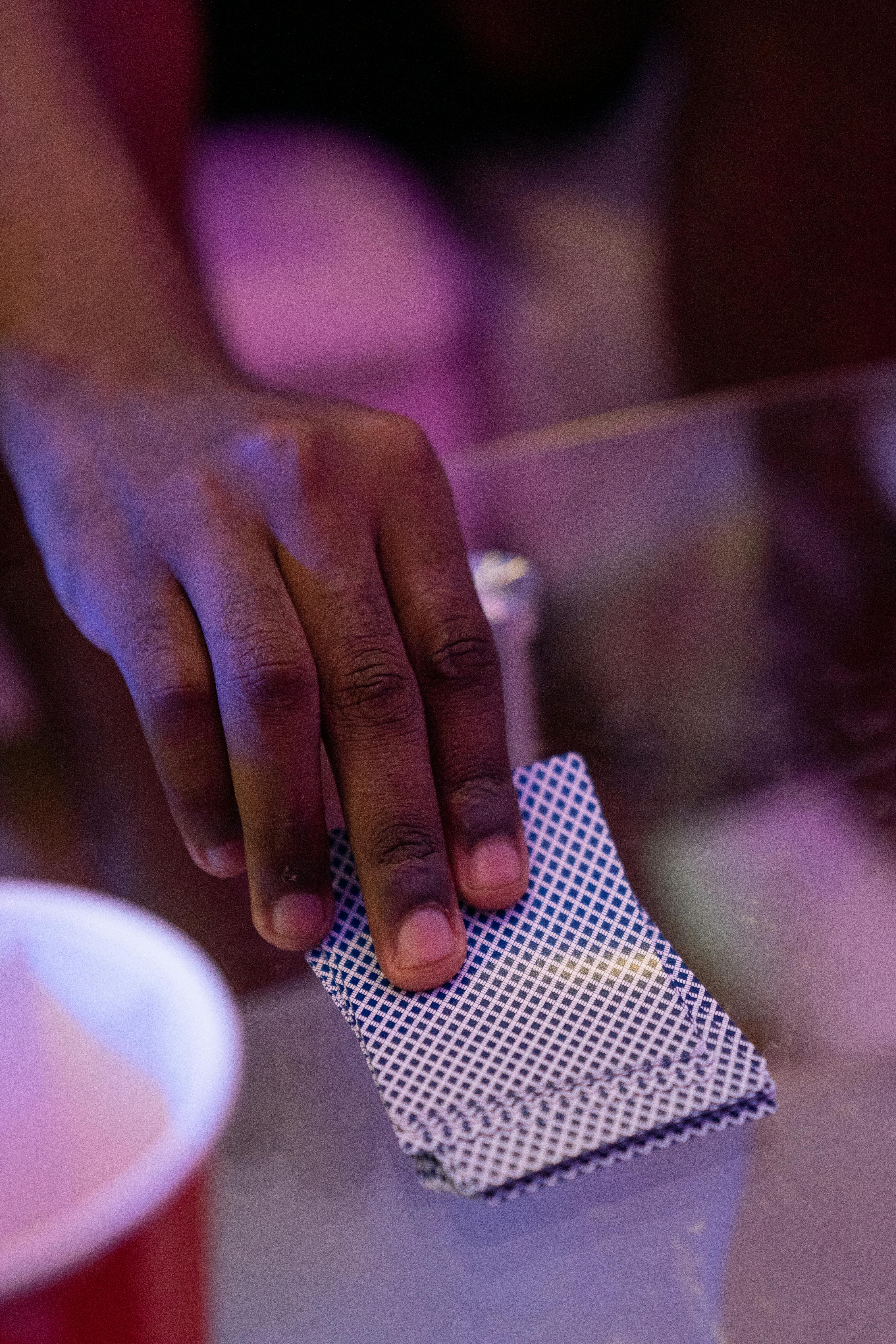 a person taking a card from a deck