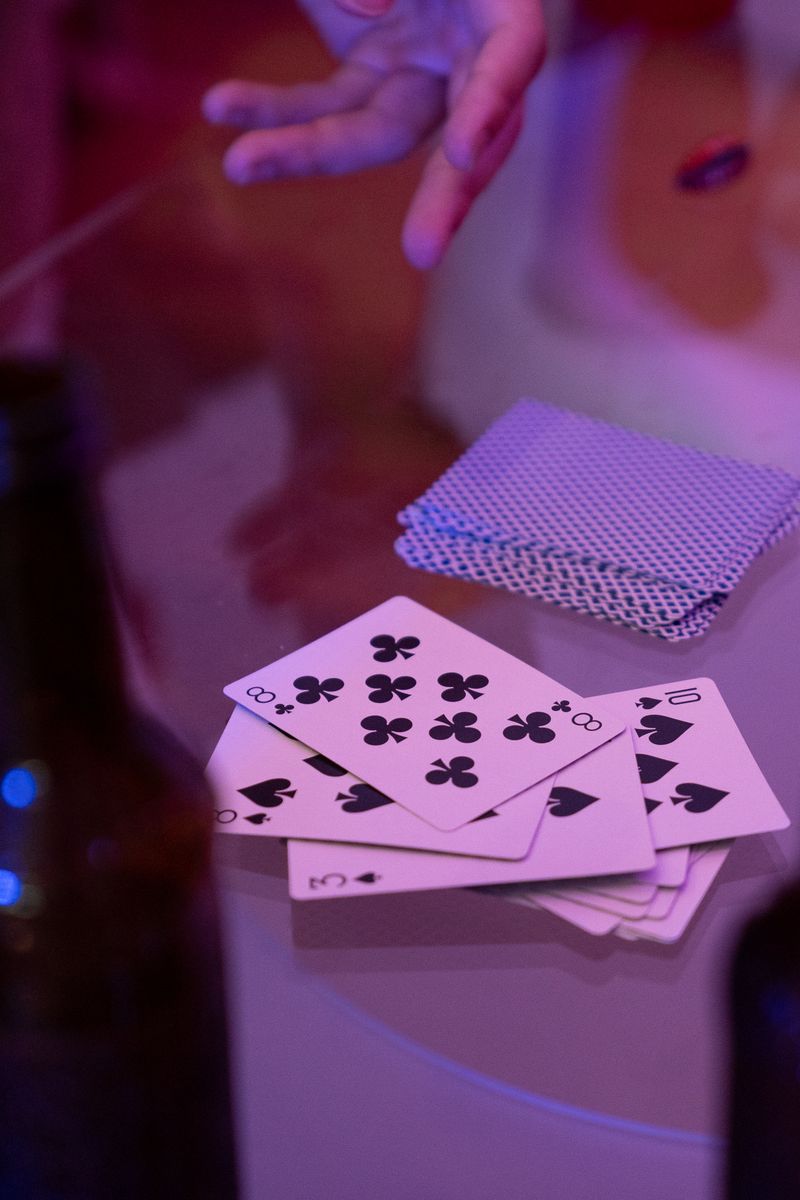 Close-up of playing cards fanned out on a table