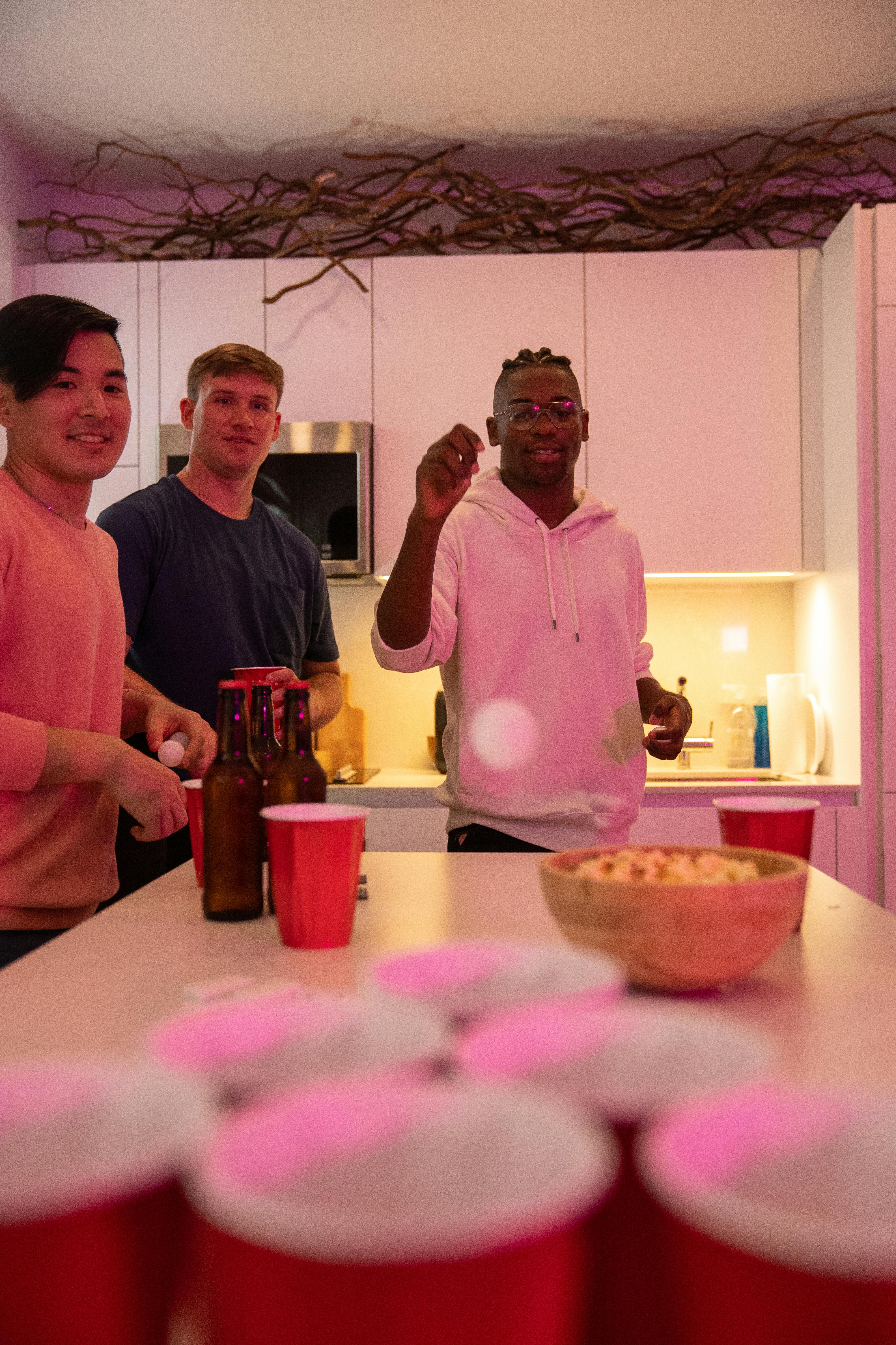 happy guys playing game at home party