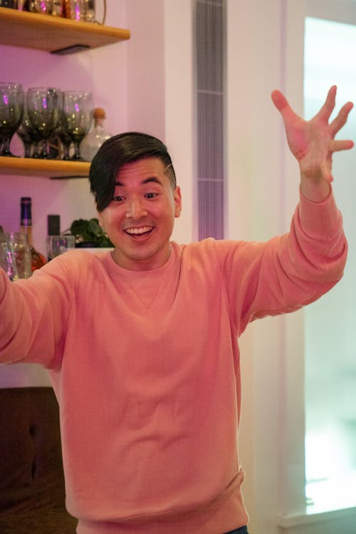 Free Happy Man in Pink Sweater Stock Photo