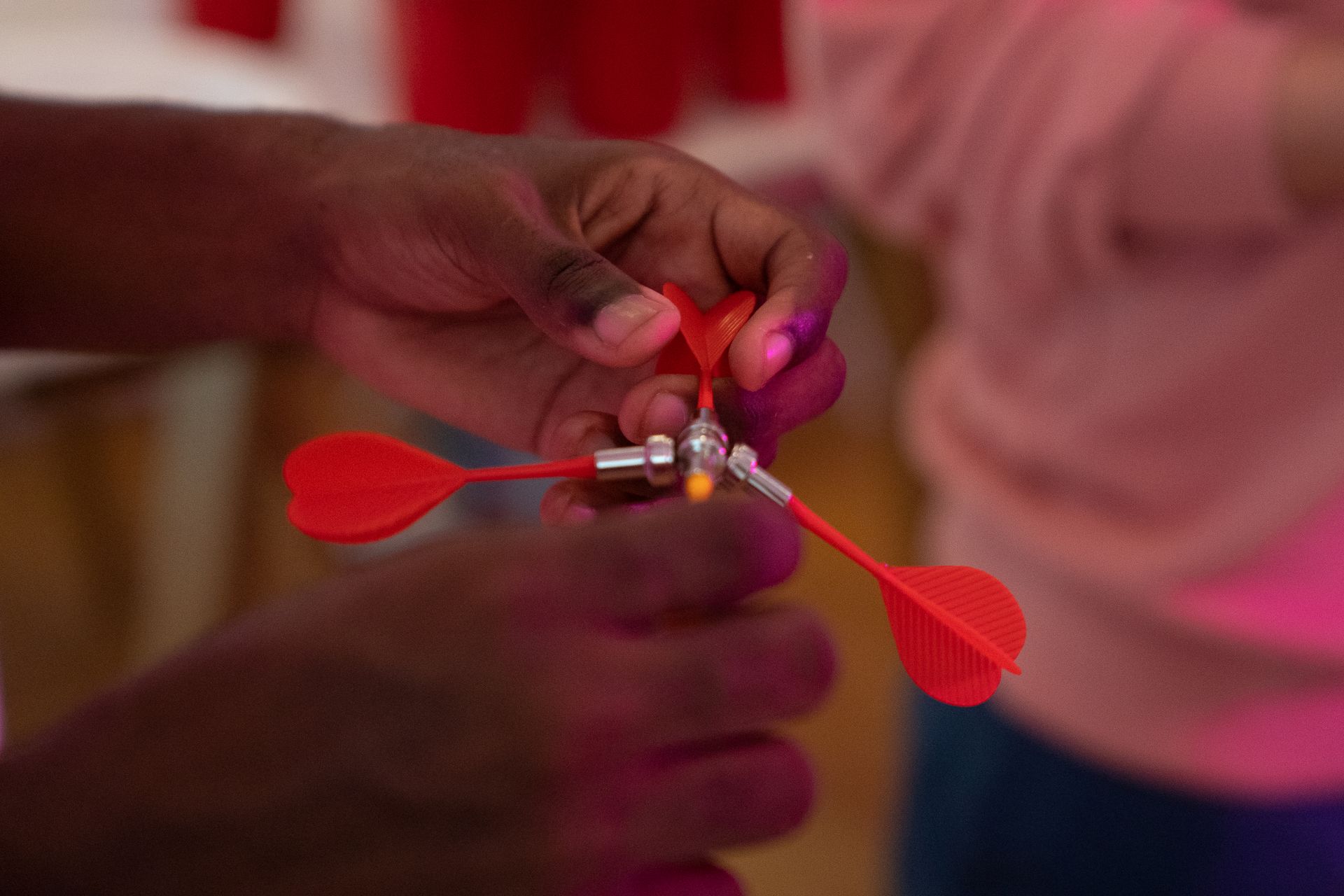 A Person Holding Red Magnetic Darts